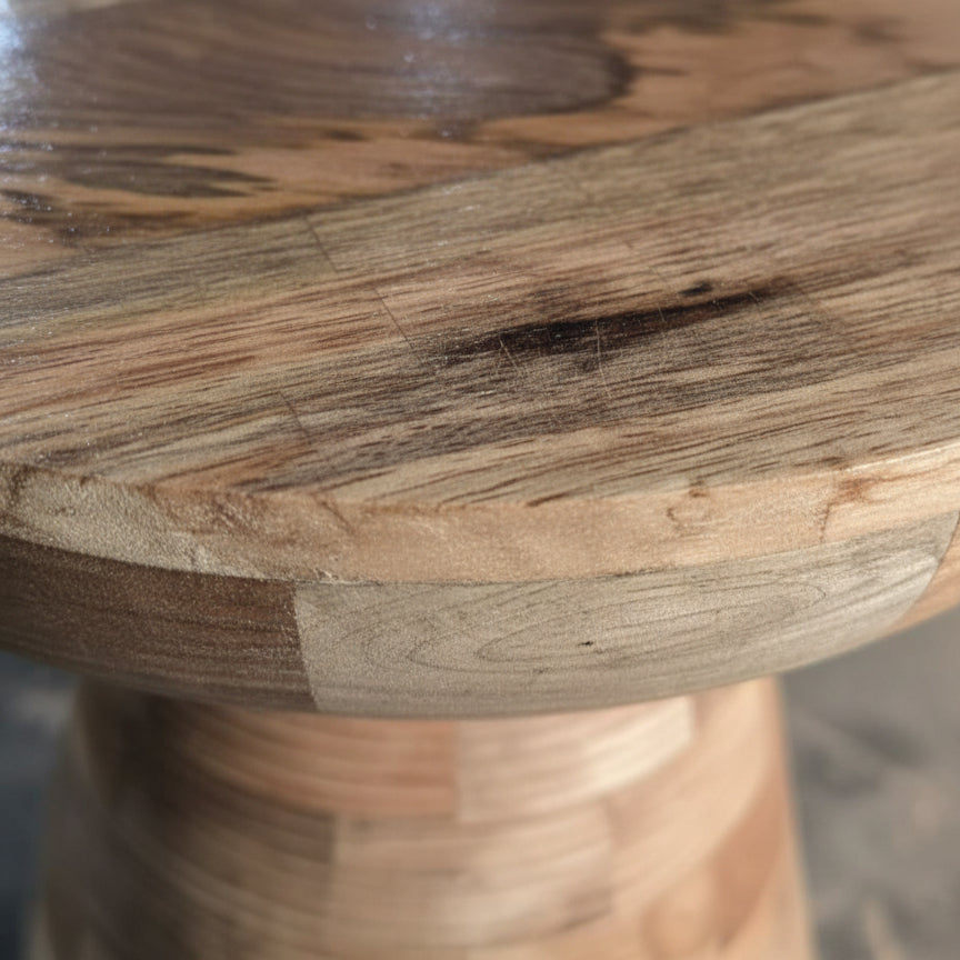 Close-up of handcrafted wooden stool with natural grain and smooth finish