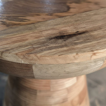Close-up of handcrafted wooden stool with natural grain and smooth finish