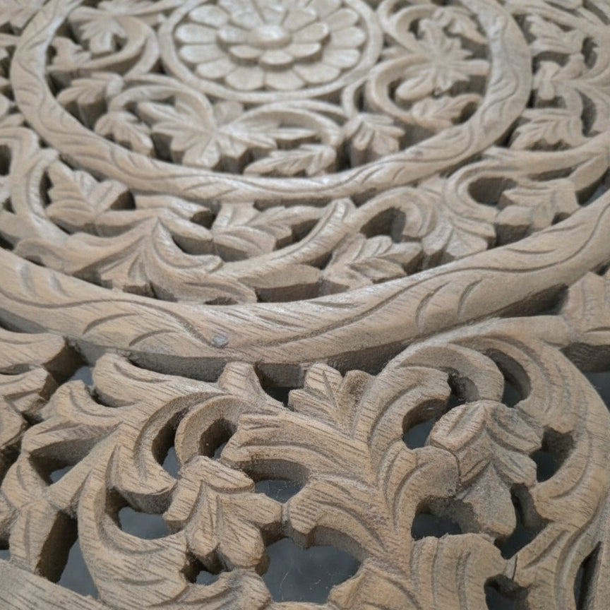 Handcrafted wooden panel with intricate floral and leaf carvings