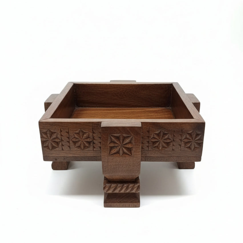 A handcrafted Ahaar Wooden Fruit Bowl featuring intricate tribal handicraft carvings on its dark wooden surface, designed as a decorative and functional piece.