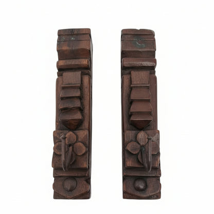 Two ornately carved Ankush Coat Hooks, each featuring geometric and floral patterns, showcase exceptional handicraft and serve as striking decor accents against a plain white background.