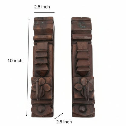 Two ornately carved Ankush Coat Hooks, each featuring geometric and floral patterns, showcase exceptional handicraft and serve as striking decor accents against a plain white background.