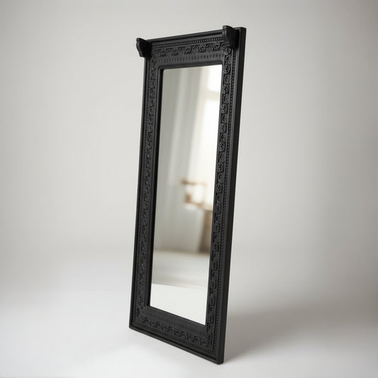 Ashva Wooden Mirror Frame in black with intricately carved wooden border, showcasing a traditional tribal handicraft design perfect for elegant home decor.