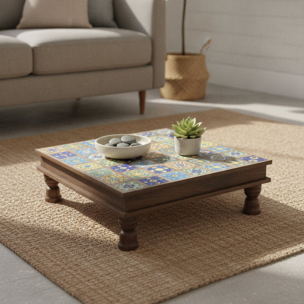 Bajot Chowki Floor Pedestal featuring a colorful tiled top and sturdy wooden legs, styled with decorative stones and a succulent, perfect for adding a tribal handicraft touch to home decor.