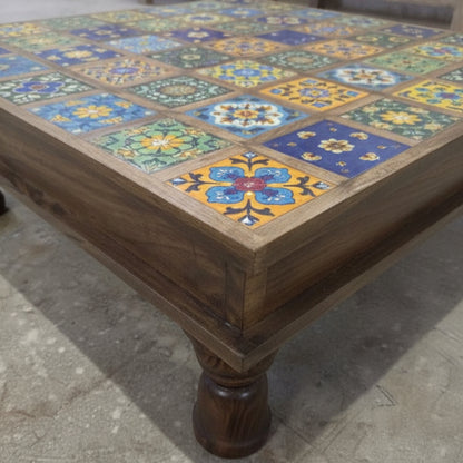 Bajot Chowki Floor Pedestal featuring a wooden frame with colorful, intricate tile patterns on top, showcasing traditional tribal handicrafts decor.