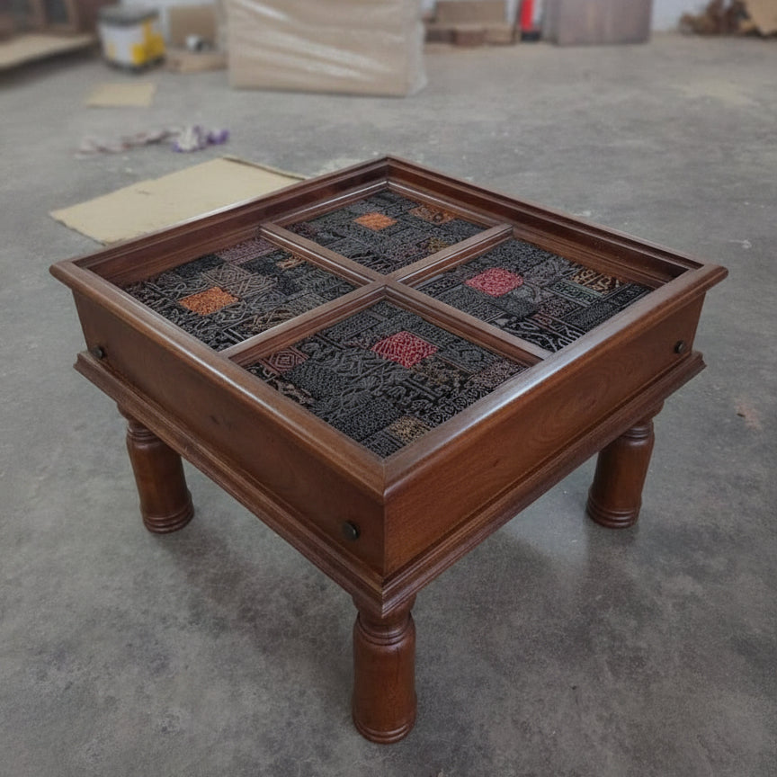 Square wooden side table with four intricately carved tribal mosaic panels, showcasing handcrafted artisan decor in rich dark and earthy tones.