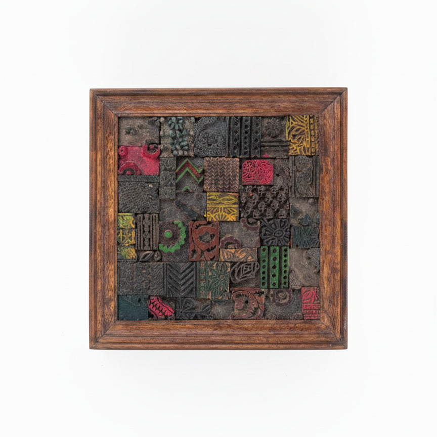 Square wooden mosaic wall art featuring handcrafted tribal-inspired blocks in various colors and patterns within a rich wooden frame, perfect for decorative home accents.