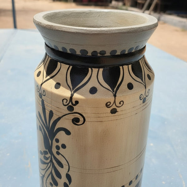 Dhyaan Hand-painted Wooden Pot featuring intricate black floral and leaf patterns on a beige background, showcasing traditional tribal handicrafts decor in wooden material.