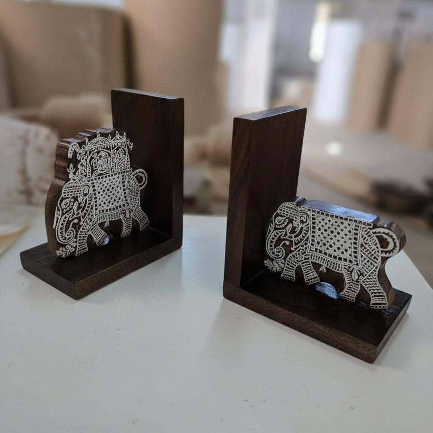 Handcrafted wooden bookends with intricately carved tribal elephant designs