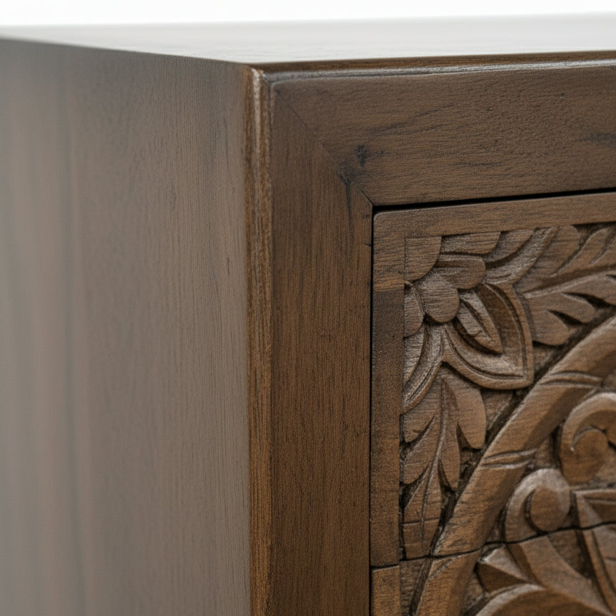 Handcrafted wooden furniture corner with intricate carved floral pattern detail