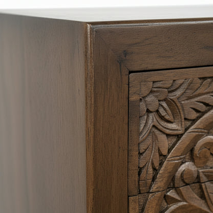 Handcrafted wooden furniture corner with intricate carved floral pattern detail