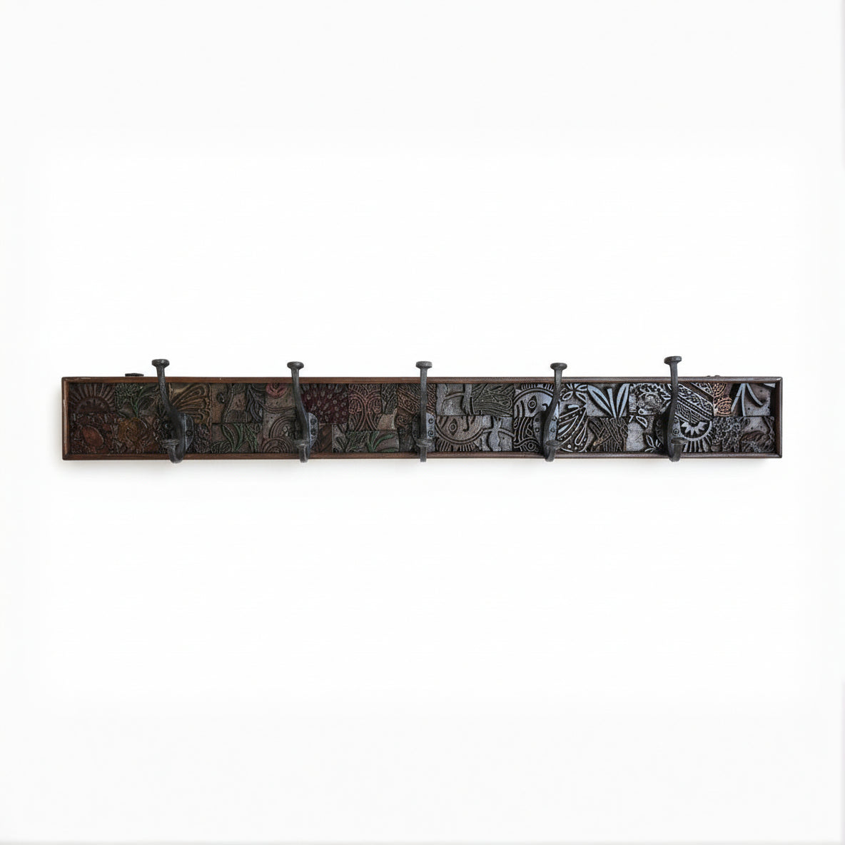 Karigar Block Coat Rack featuring a long wooden panel with intricate tribal handicraft patterns and six metal hooks, perfect for stylish decor and functional use.