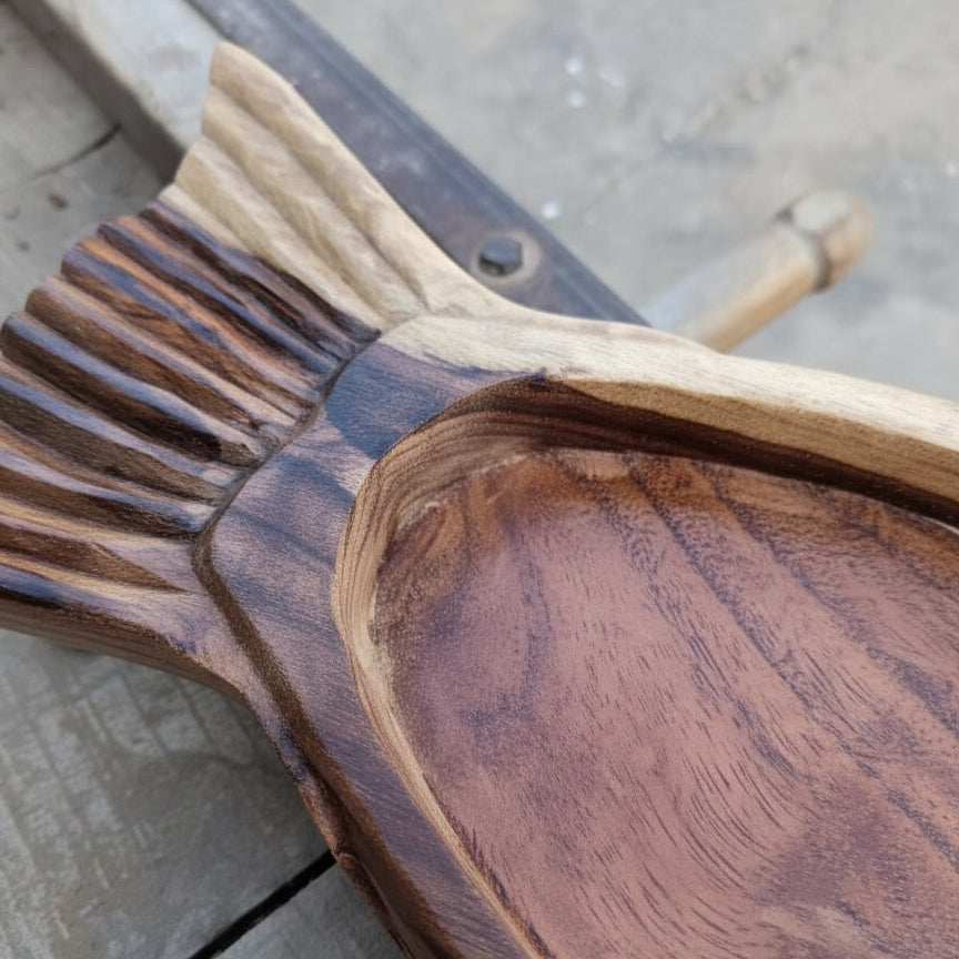 Close-up of a handcrafted Matsya Wooden Organizer Tray with detailed carved fish tail design, showcasing rich natural wood grain and smooth finish for elegant decor.