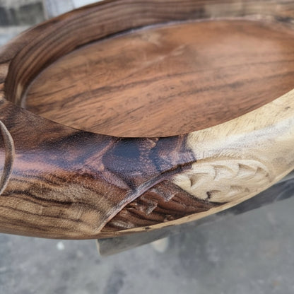 Close-up of the corner of a Matsya Wooden Organizer Tray showcasing detailed hand-carved wooden patterns and natural wood grain in warm brown tones.