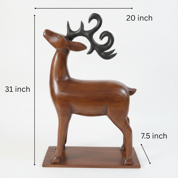 The Mriga Wooden Deer Sculpture features a smooth, upward-tilting head with black, stylized antlers and stands gracefully on a rectangular wooden base against a plain white background—an elegant decor piece that beautifully highlights fine wooden craftsmanship.
