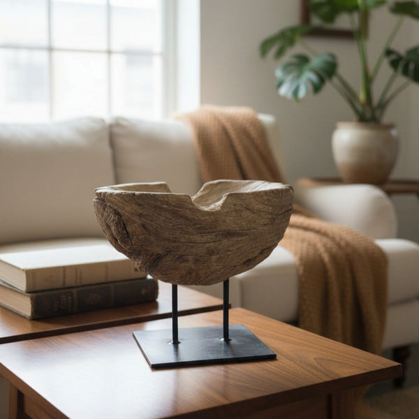 Prakriti Root Bowl Decor displayed on a wooden stand, showcasing natural wooden texture and organic shape, placed on a coffee table in a cozy living room setting.