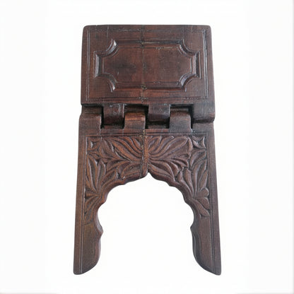 Rehal Wooden Carved Bookstand made of dark wood featuring intricate floral and geometric carving, designed for holding books or holy scriptures as a decorative handicraft piece.