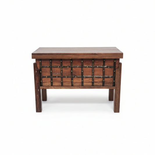 Wooden storage box with metal accents featuring a handcrafted tribal design, blending rustic decor and durable craftsmanship for unique home storage solutions.