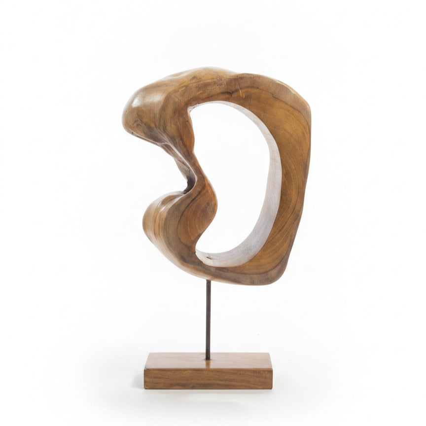Abstract wooden art piece with smooth curves and organic shapes, handcrafted from solid wood and mounted on a minimalist stand, showcasing unique tribal-inspired decor craftsmanship.