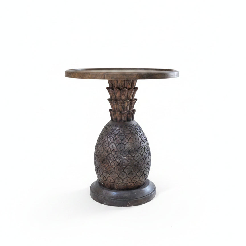Handcrafted wooden side table with a carved pineapple design base, showcasing tribal handicraft artistry and elegant rustic decor.