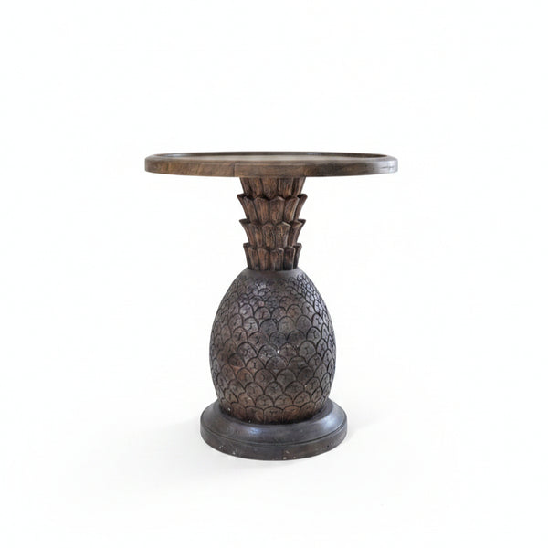 Handcrafted wooden side table with a carved pineapple design base, showcasing tribal handicraft artistry and elegant rustic decor.