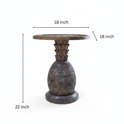 Handcrafted wooden side table with a carved pineapple design base, showcasing tribal handicraft artistry and elegant rustic decor.