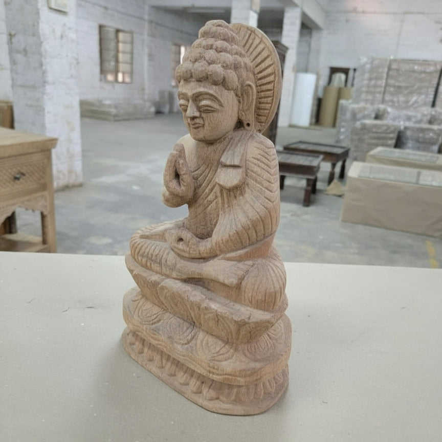 Handcrafted wooden Buddha statue, tribal art figurine in a workshop setting
