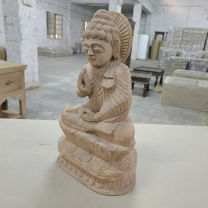 Handcrafted wooden Buddha statue, tribal art figurine in a workshop setting