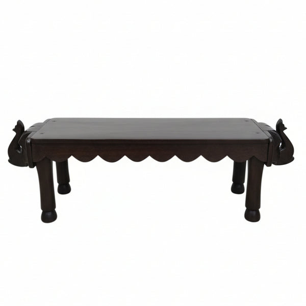 Vahana Carved Wooden Bench featuring intricately carved elephant head accents on both ends, showcasing traditional tribal handicrafts and detailed wooden decor design.