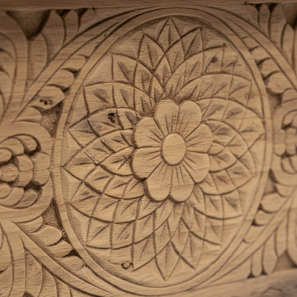 Intricate floral mandala pattern carved on natural wood, tribal handicraft detail