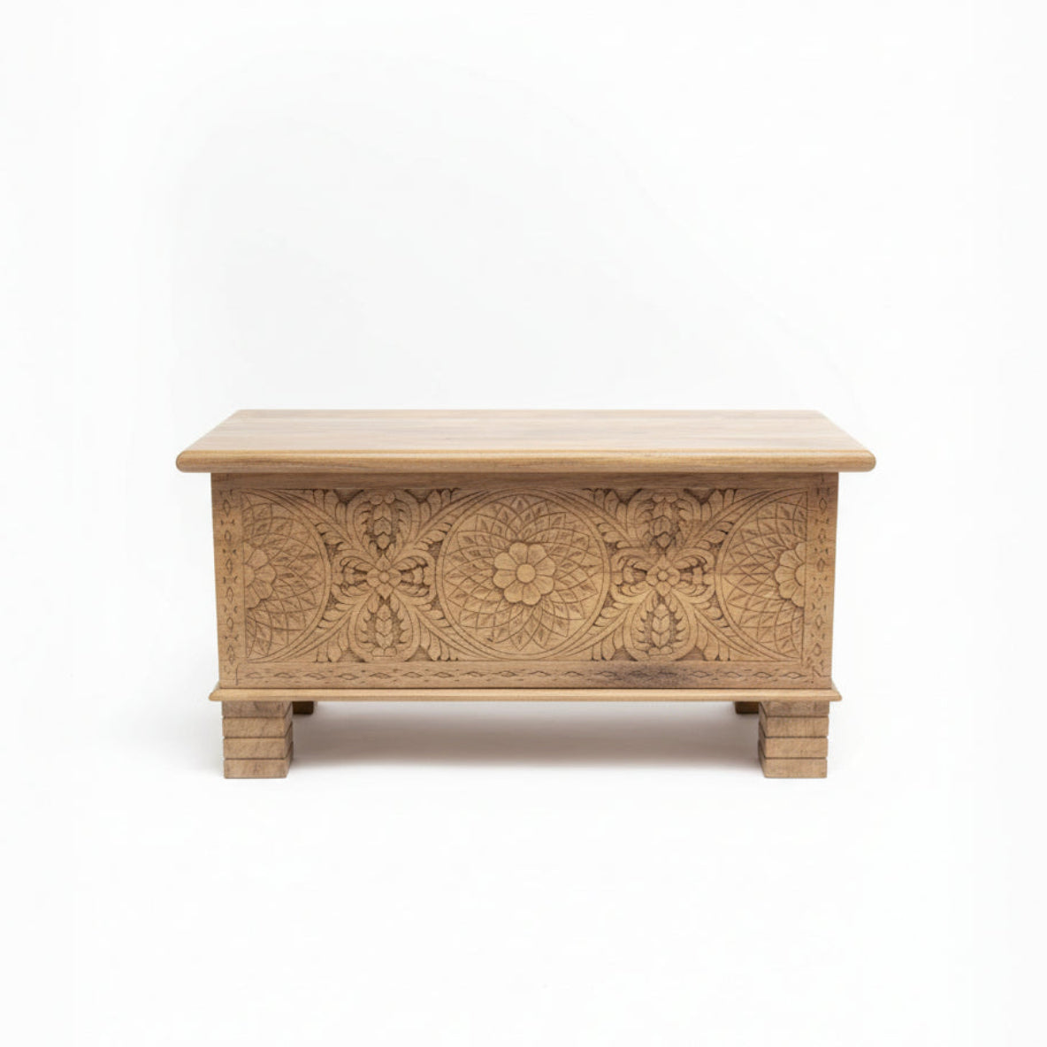 Handcrafted wooden storage chest with intricate tribal floral carvings on front panel