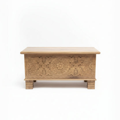 Handcrafted wooden storage chest with intricate tribal floral carvings on front panel