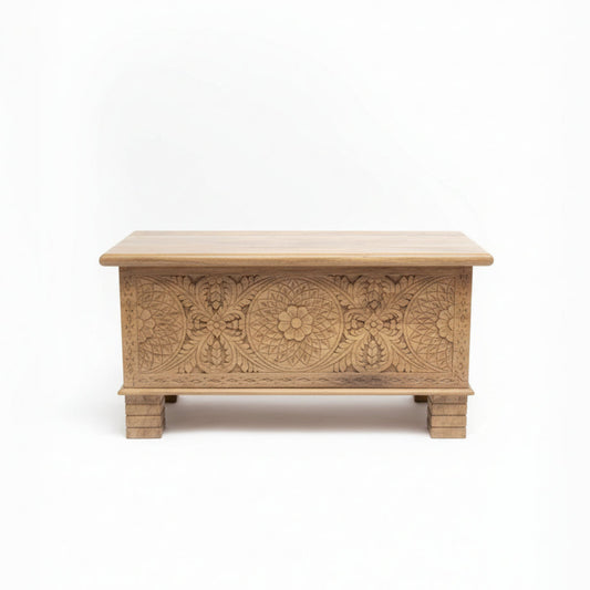 Handcrafted wooden storage chest with intricate tribal floral carvings on front panel