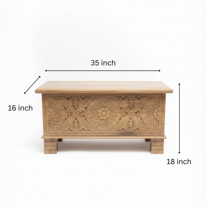 Handcrafted wooden storage chest with intricate tribal floral carvings on front panel