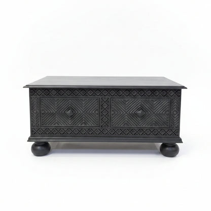 Yantra Storage Coffee Unit in dark wood with intricate tribal handicraft patterns, featuring two front drawers and rounded legs, perfect for stylish decor and storage.