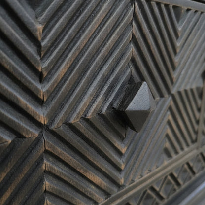 Close-up of the textured geometric wooden pattern and handle detail on the Yantra Storage Coffee Unit, showcasing handcrafted decor with a tribal handicraft style.